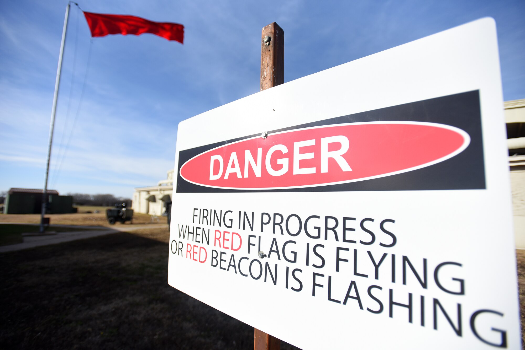 A red flag is displayed to indicate active weapons training at the combat arms training and maintenance range Nov. 20, 2017, at McConnell Air Force Base, Kansas. Airmen attend CATM prior to deployment, some permanent changes of station and annually for Airmen who carry weapons on a daily basis for their job. (U.S. Air Force photo by Airman Michaela R. Slanchik)