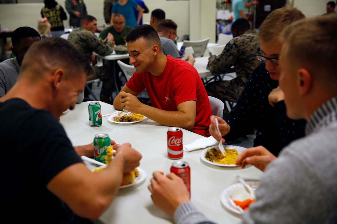 Marines share Thanksgiving meal.