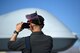 An attendee takes a photo of the MQ-9 Reaper at the 2017 Aviation Nation Air and space Expo, Nov. 11, 2017, at Nellis Air Force Base, Nev. More than 165,000 people attended the two day event showcasing America's airpower.