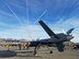 An MQ-9 Reaper assigned to the 432nd Wing/432nd Air Expeditionary Wing sits on the flightline as the U.S. Air Force Thunderbirds fly overhead at the 2017 Aviation Nation Air and space Expo, Nov. 11, 2017, at Nellis Air Force Base, Nev. The two day event showcased some of the Air Force's premier aircraft and personnel dedicated to air superiority and served as the closing ceremony for the 70th birthday anniversary.