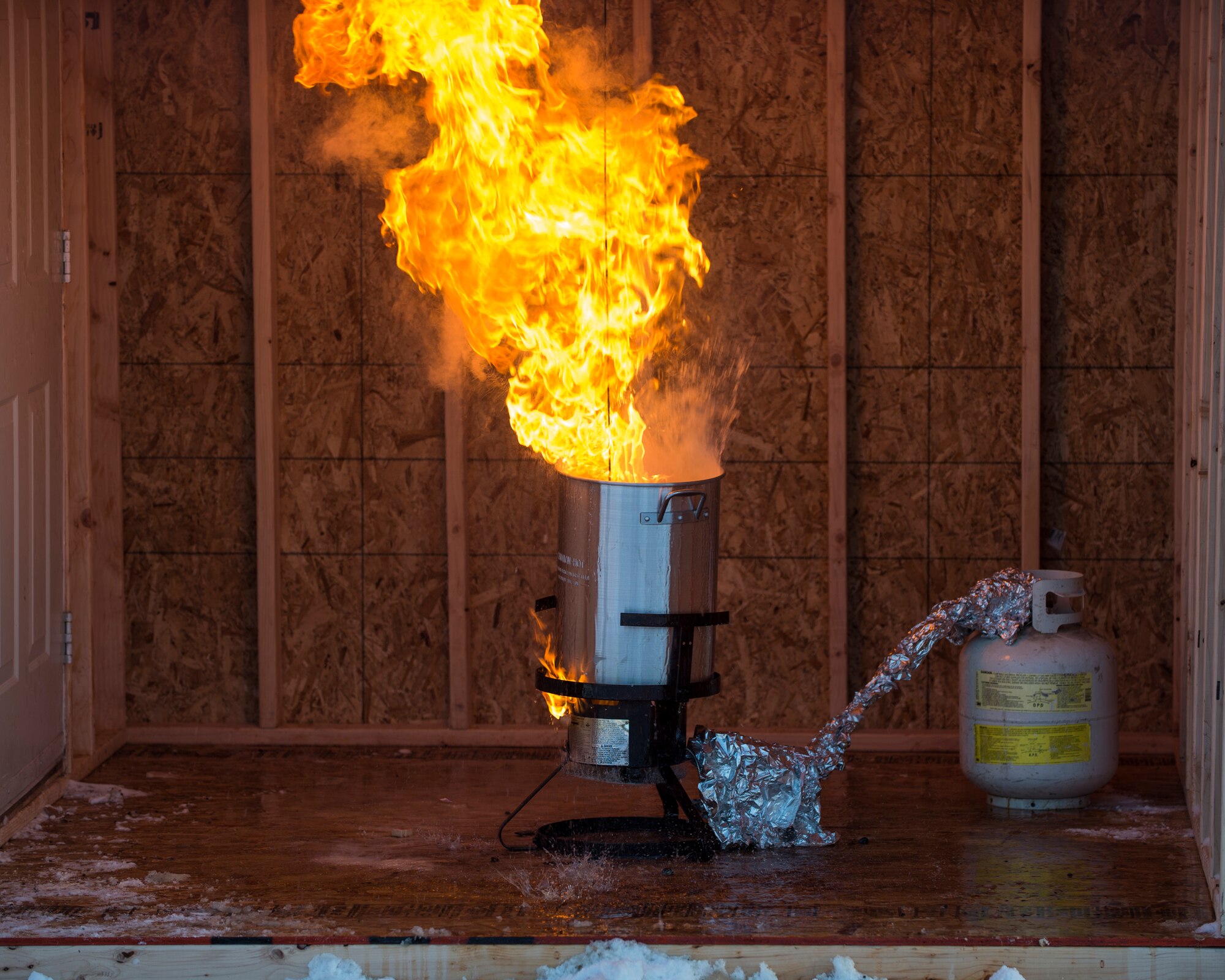 A turkey fryer is engulfed in flames during a fire safety demonstration at Joint Base Elmendorf-Richardson, Alaska, Nov. 13, 2017. The demonstration raised public awareness on the dangers of deep-frying turkeys and showed what not to do along with proper turkey-frying techniques.
