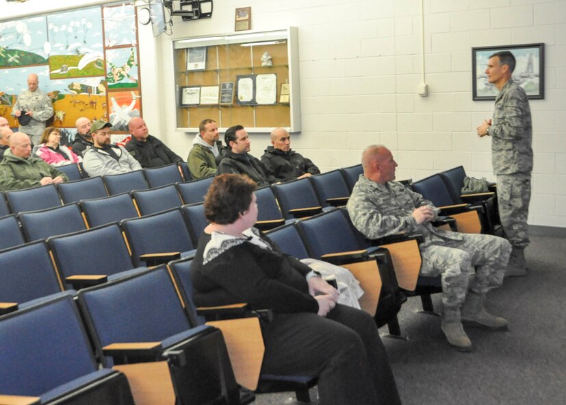 Col. Dan Sarachene, 910th Airlift Wing commander, briefs local law enforcement officials before an orientation flight aboard a 910th C-130 here, Nov. 21, 2017.