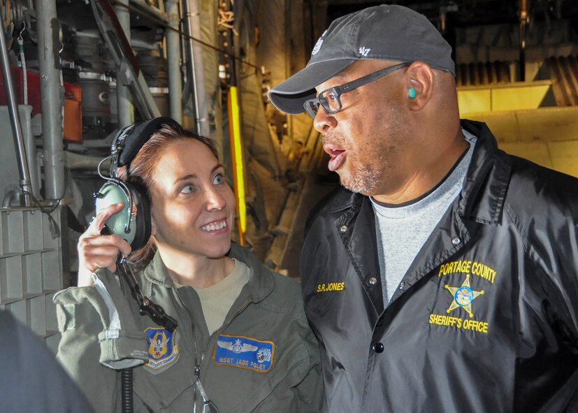 Col. Dan Sarachene, 910th Airlift Wing commander, briefs local law enforcement officials before an orientation flight aboard a 910th C-130 here, Nov. 21, 2017.