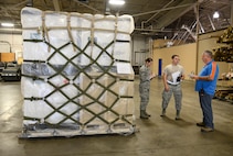 James Eye, 72nd Logistics Readiness Squadron, conducts an inspection of a pallet of medical supplies ready for loading for a potential deployment Oct. 4, 2017, Tinker Air Force Base, Oklahoma. Eye speaks with Senior Airmen Olivia Chapman and Nicholas Frazier, 72nd Medical Support Squadron, and lets them know what their team did correctly on building the pallet and what items they need to work on in the future.