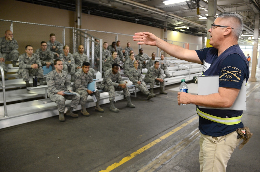 Brett Neeley, traffic management specialist, 72nd Logistics Readiness Squadron, instructs exercise deployers on the next phase of the mobility process Oct. 4, 2017, Tinker Air Force Base, Oklahoma.