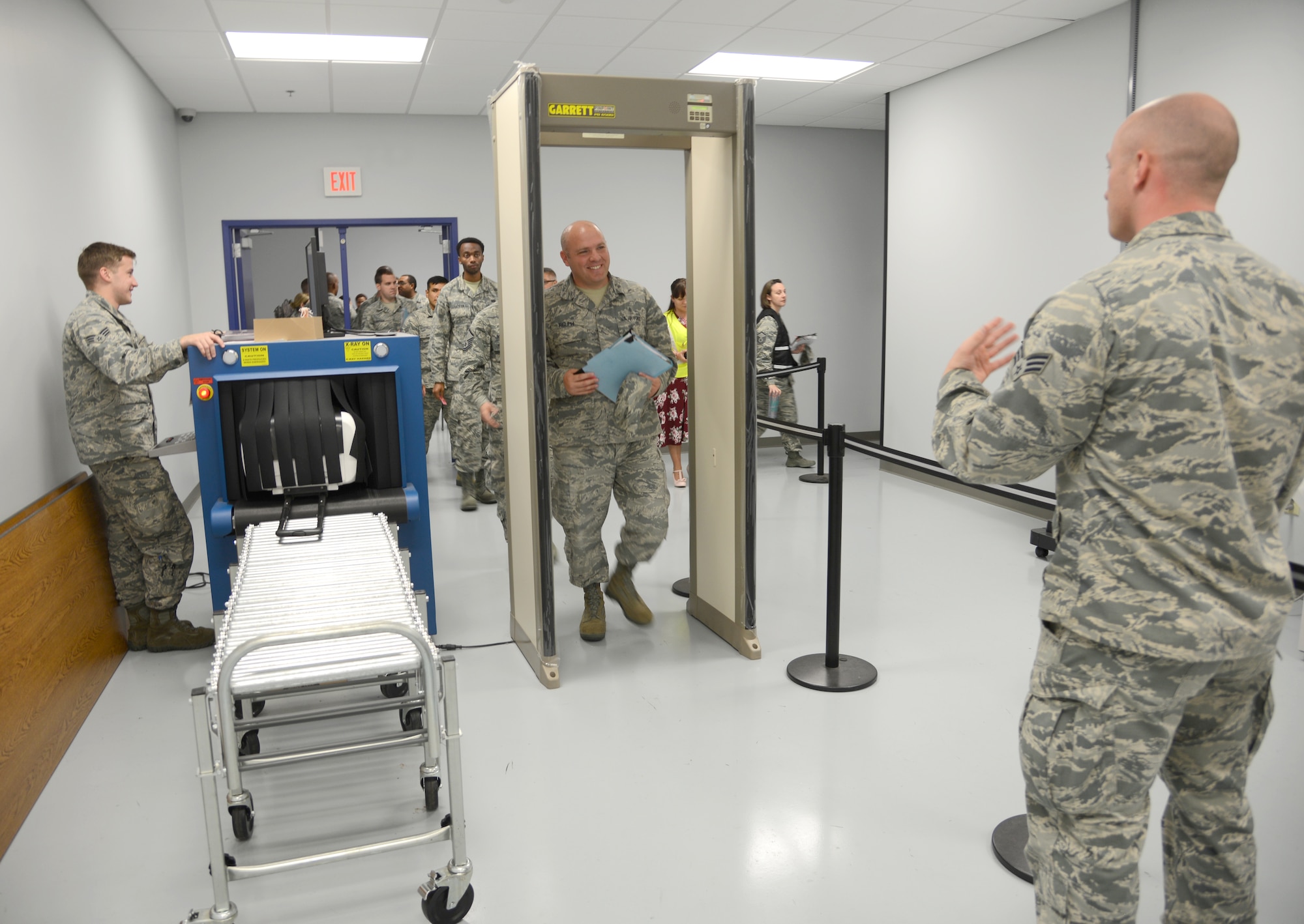 Senior Airman Sidney Laxdal, left, and Senior Airman Richard Loveless, right, 72nd Logistics Readiness Squadron, work the baggage check and security checkpoint area during a recent mobility exercise Oct. 4, 2017, Tinker Air Force Base, Oklahoma.