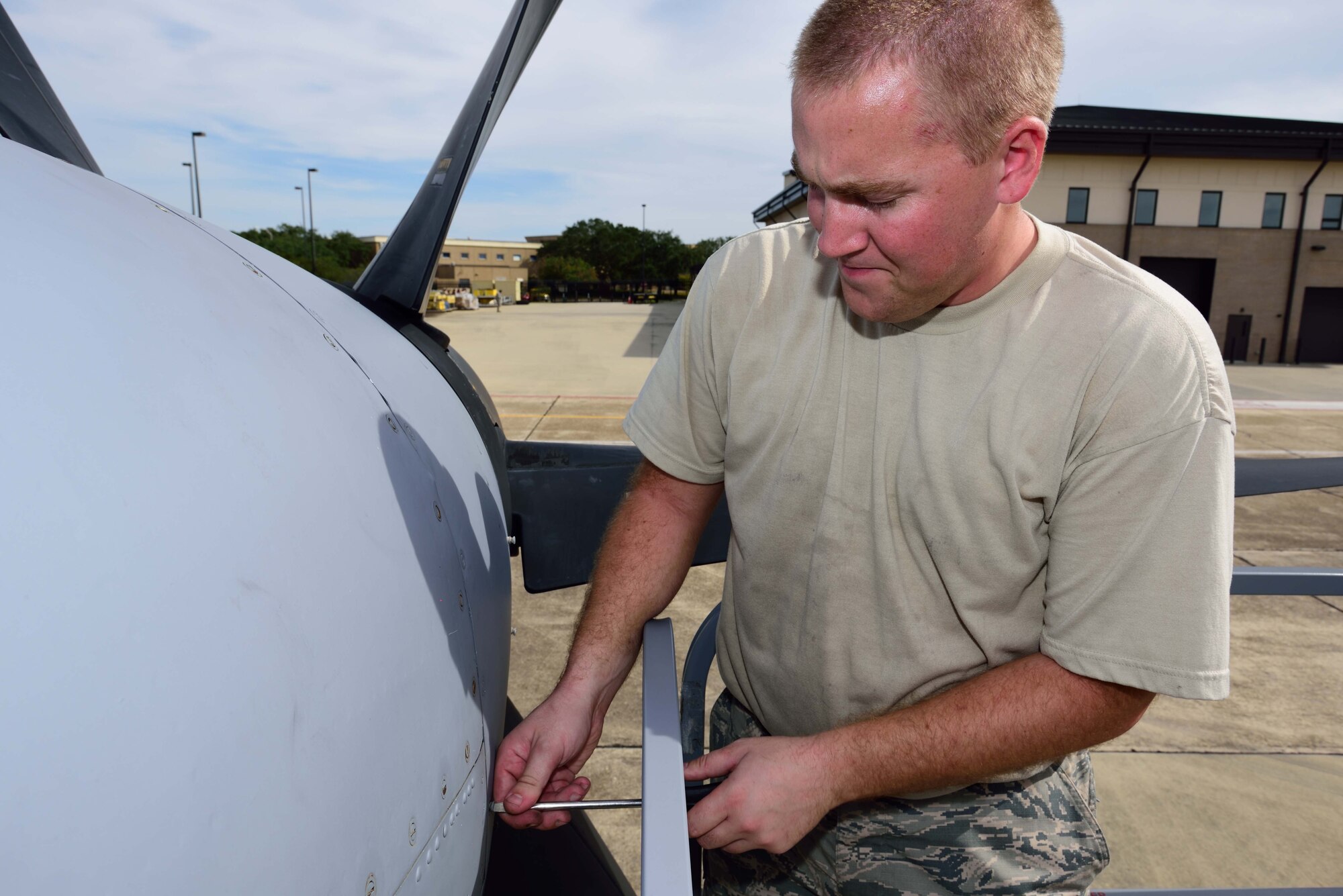Staff Sgt. Brandon Reichert, 803rd Aircraft Maintenance Squadron engine technician, secures a panel on a C-130J Super Hercules aircraft after helping install and adjust a propeller brush block, Oct. 20, 2017, at Keesler Air Force Base, Mississippi. The Citizen Airmen working for the 803rd AMXS ensure that the aircraft for the 815th Airlift Squadron here are ready to deploy in support of the Air Force mission. (U.S. Air Force photo by Tech. Sgt. Ryan Labadens)