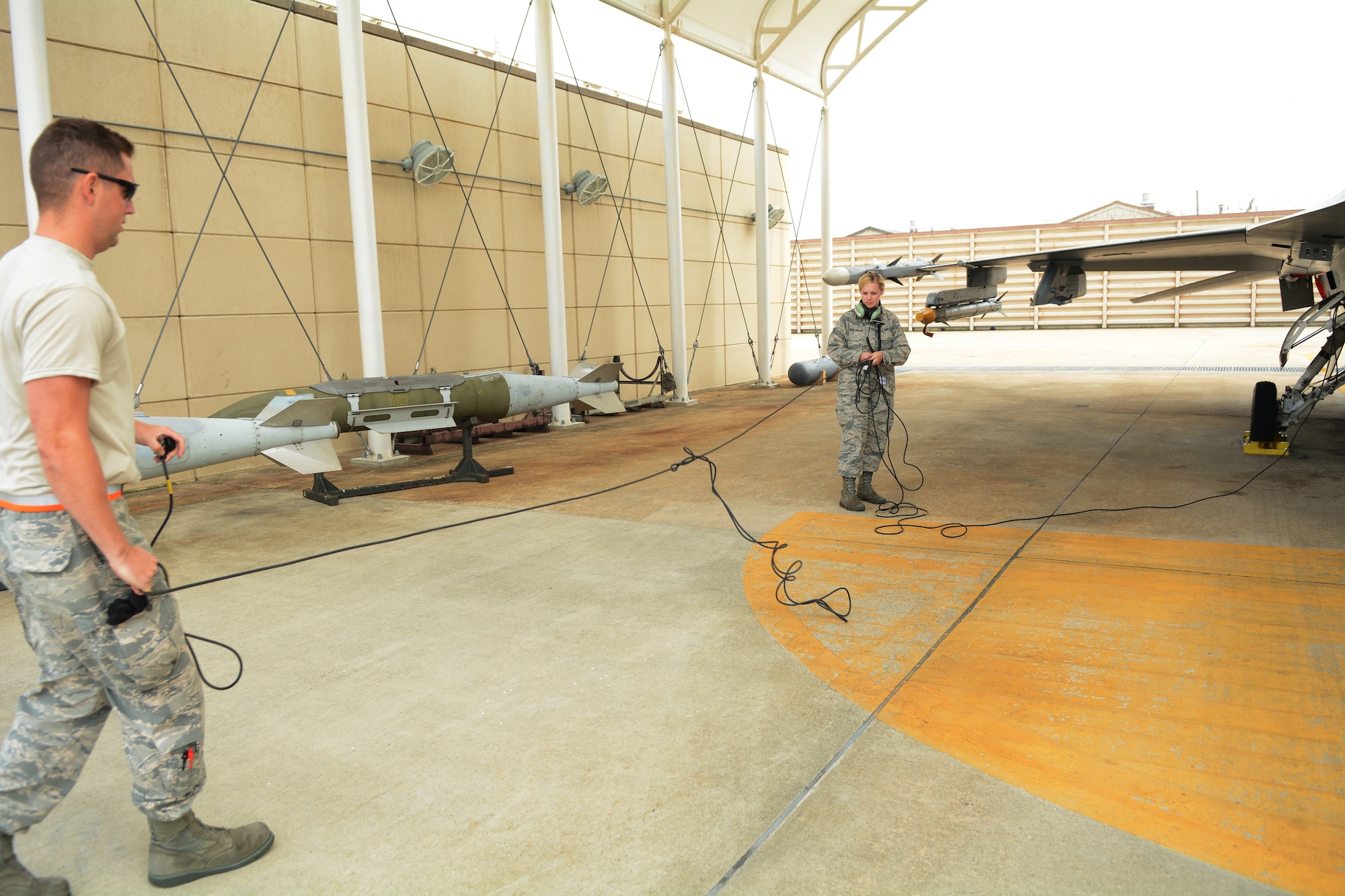 Staff Sgt. Chad Gaffney, a crew chief deployed with the 176th Expeditionary Aircraft Maintenance Unit and Senior Airman Molly Hermanson, an administrative journeyman with the 115th Fighter Wing, prepare an F-16 Fighting Falcon for launch at Kunsan Air Base, Republic of Korea, Sept. 19, 2017. Hermanson was able to assist with the launch through a Y-cord attached to her headset that allowed her to walk through alongside Gaffney.  Airmen from the 115th Fighter Wing, Wisconsin Air National Guard, are deployed to Kunsan for a 3-month rotation as part of a Theater Security Package, which helps to maintain a deterrent against threats to regional security and stability. (U.S. Air National Guard photo by Tech. Sgt. Meghan Skrepenski)