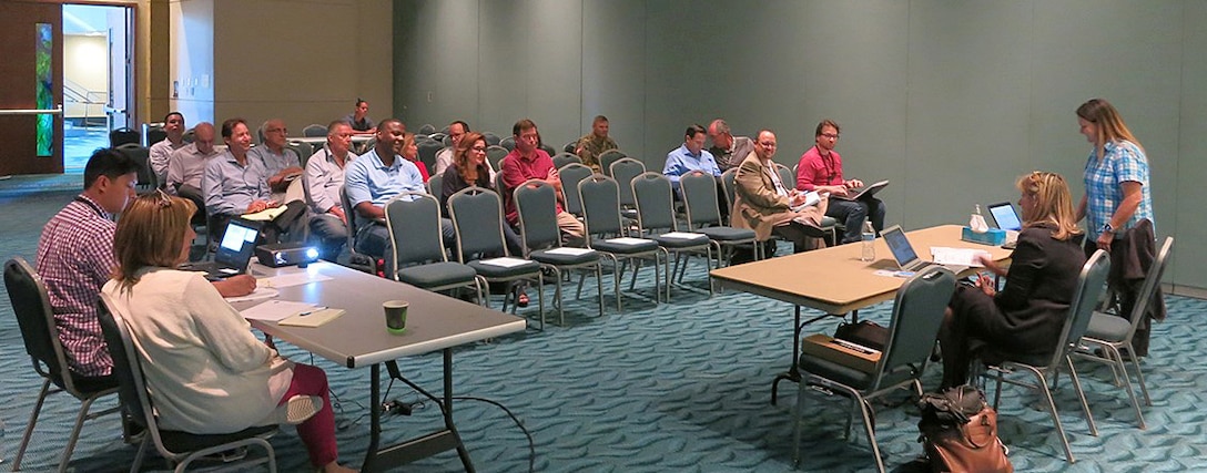 Puerto Rico Business Emergency Operations Center participants meet Nov. 13 at the Sheraton Hotel in Isla Grande section of San Juan, Puerto Rico, to develop plans to help local businesses participate in recovery-related contracting opportunities. The group, with local input, coordinates efforts to anticipate and eliminate barriers to getting Puerto Rico back in business.