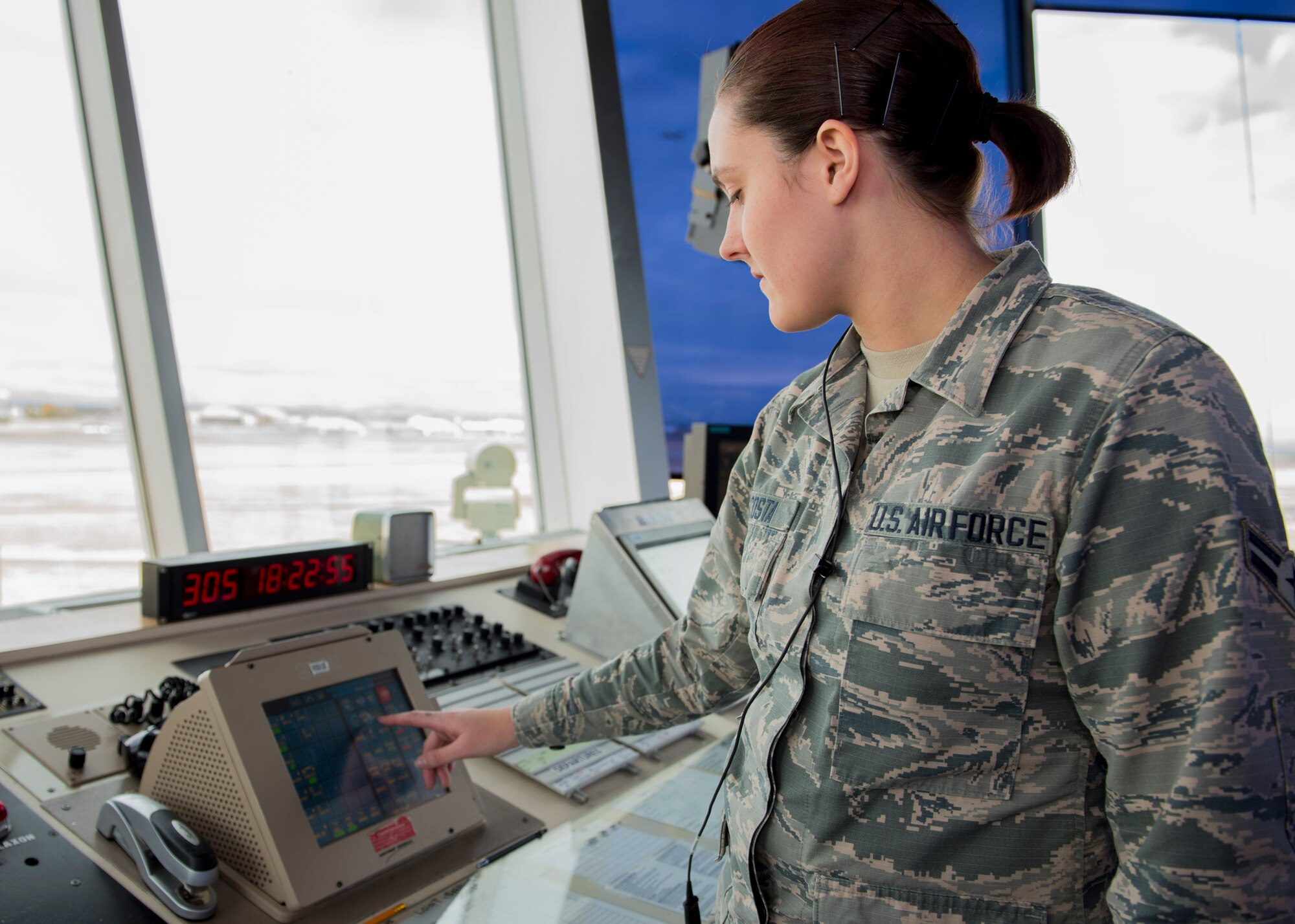 Airman 1st Class Kayde Decosta, 92nd Operations Support Squadron air traffic controller, selects a communication channel to speak with ground crews during Exercise Global Thunder 2018 at Fairchild Air Force Base, Washington, Nov. 1, 2017. Global Thunder is an annual U.S. Strategic Command (USSTRATCOM) exercise designed to provide training opportunities to test and validate command, control and operational procedures. The training is based on a notional scenario developed to drive execution of USSTRATCOM and component forces’ ability to support the geographic combatant commands, deter adversaries and, if necessary, employ forces as directed by the President of the United States. (U.S. Air Force photo/Senior Airman Ryan Lackey)