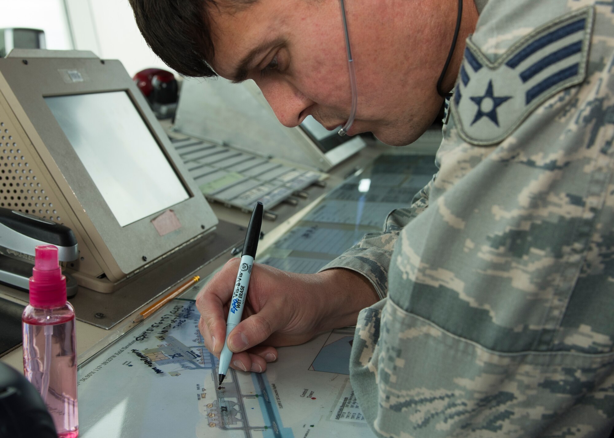 Senior Airman Adan Esqueda, 92nd Operations Support Squadron air traffic controller, marks aircraft parking spots during Exercise Global Thunder 2018 at Fairchild Air Force Base, Washington, Nov. 1, 2017. Global Thunder is an annual U.S. Strategic Command (USSTRATCOM) exercise designed to provide training opportunities to test and validate command, control and operational procedures. The training is based on a notional scenario developed to drive execution of USSTRATCOM and component forces’ ability to support the geographic combatant commands, deter adversaries and, if necessary, employ forces as directed by the President of the United States. (U.S. Air Force photo/Senior Airman Ryan Lackey)