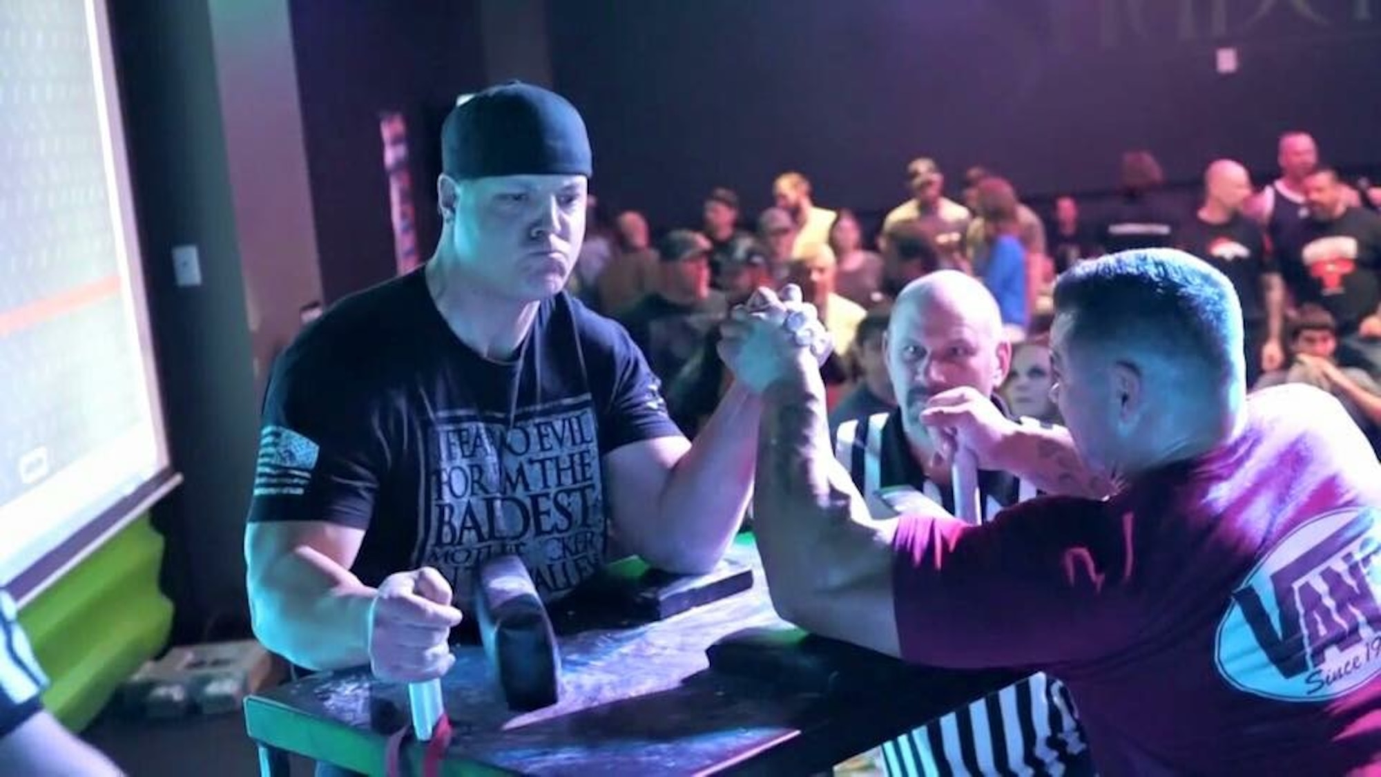 Tech. Sgt. Driggs arm wrestling