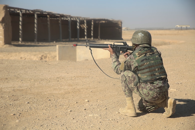An Afghan National Army soldier with 6th Kandak, 1st Brigade, 215th Corps searches for notional enemy fighters during casualty evacuation training at Camp Shorabak, Afghanistan, Nov. 19, 2017. The Helmand Regional Military Training Center implemented its first iteration of CASEVAC training using Afghan air assets as part of the operational readiness cycle to help prepare its students for real-world missions. U.S. advisors assigned to various train, advise, assist commands from throughout Afghanistan observed the training in preparation for integrating standardized CASEVAC rehearsals into their unit’s ORCs. (U.S. Marine Corps photo by Sgt. Lucas Hopkins)