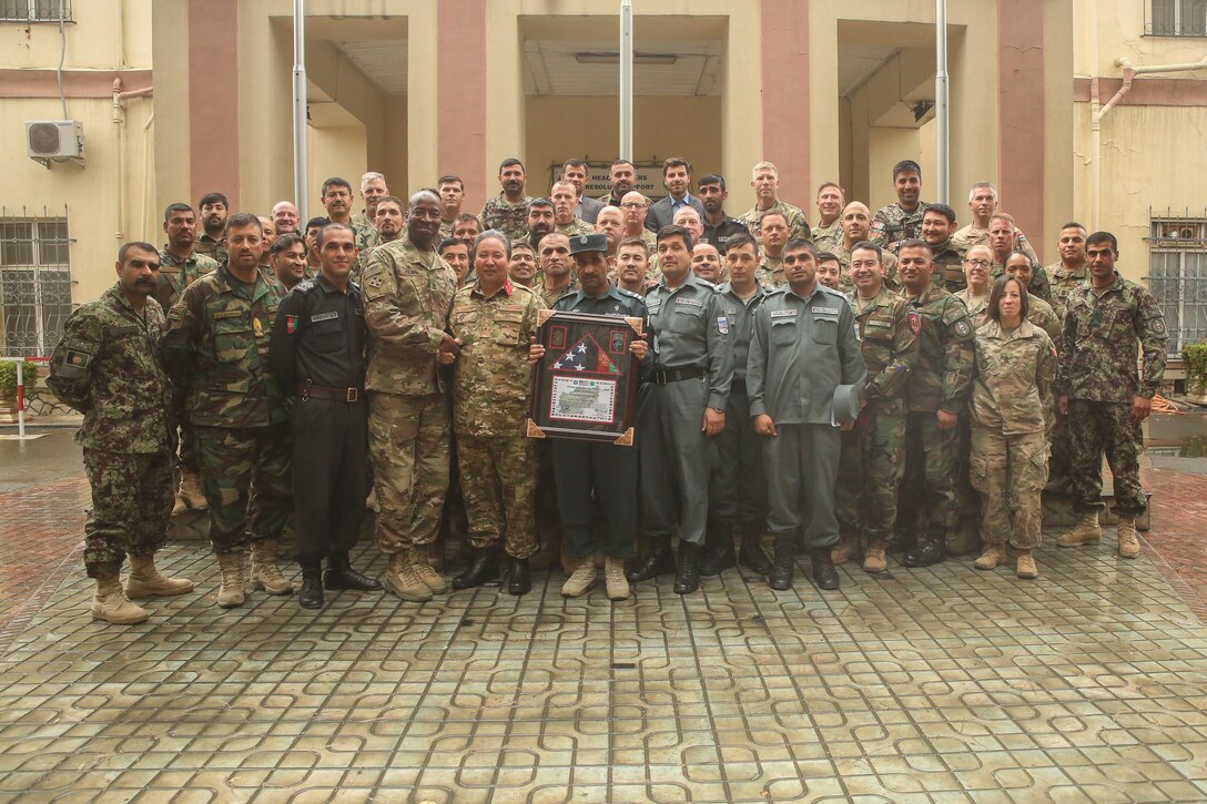 U.S. military and Afghan National Defense and Security Force personnel pose for a photo during a warfighter forum at Resolute Support Headquarters in Kabul, Afghanistan, Nov. 15, 2017. Senior enlisted U.S. and ANDSF leaders gathered for the two-day event to discuss current issues such as accountability, mortuary affairs, female integration and force protection, and formulated potential solutions to further develop the professionalism of the Afghan services. (U.S. Marine Corps photo by Sgt. Lucas Hopkins)