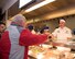 Chief Master Sgt. Aaron Bennett, 86th Airlift Wing command chief, serves Airmen during a Thanksgiving meal at Ramstein Air Base, Germany, Nov. 23, 2017.