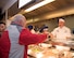 Chief Master Sgt. Aaron Bennett, 86th Airlift Wing command chief, serves Airmen during a Thanksgiving meal at Ramstein Air Base, Germany, Nov. 23, 2017.