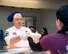 Chief Master Sgt. Aaron Bennett, 86th Airlift Wing command chief, serves Airmen during a Thanksgiving meal at Ramstein Air Base, Germany, Nov. 23, 2017.