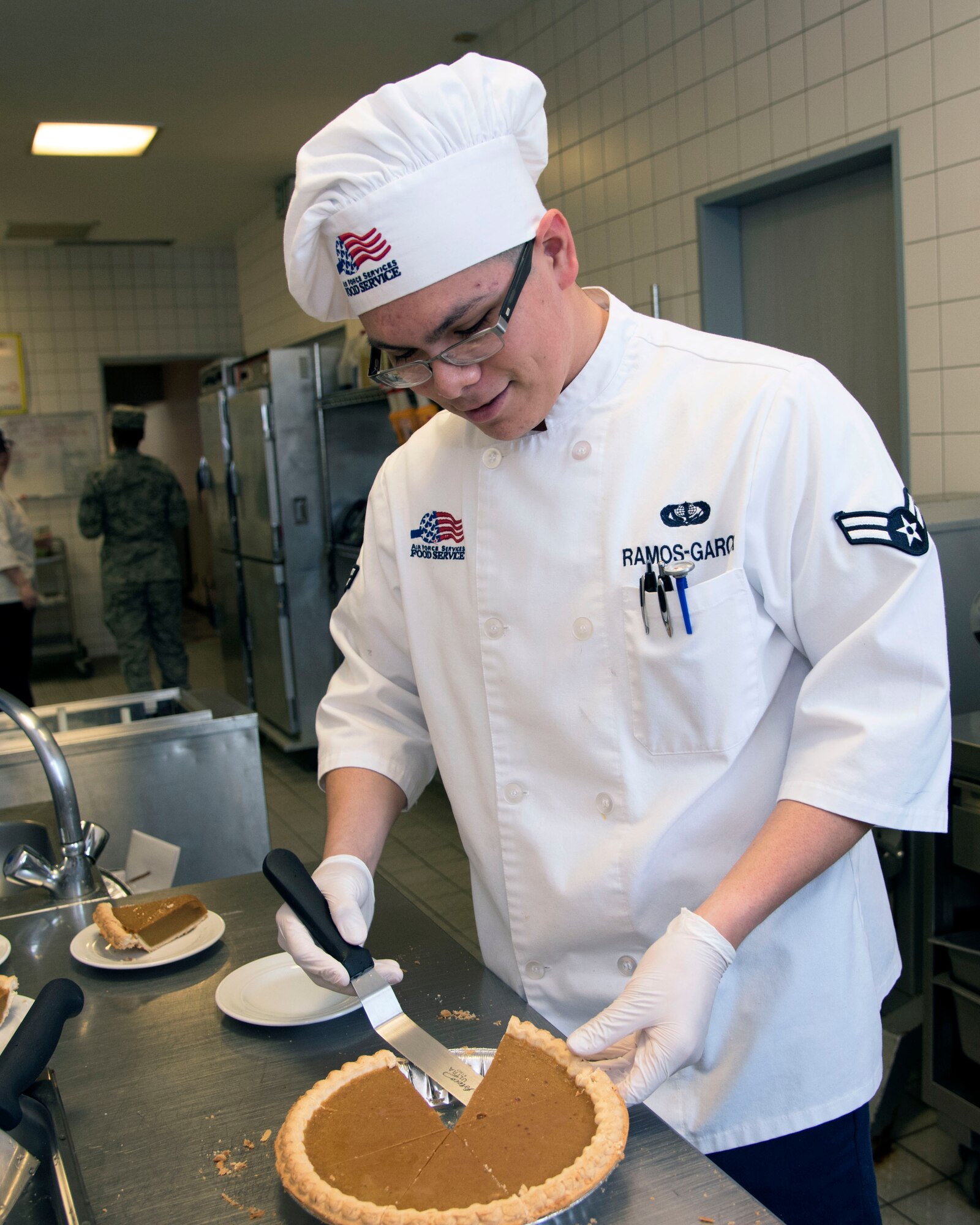 Airman 1st Class Saul Ramos-Garcia, 786th Force Support Squadron food service apprentice, prepares desserts during the Thanksgiving meal at Ramstein Air Base, Germany, Nov. 23, 2017.