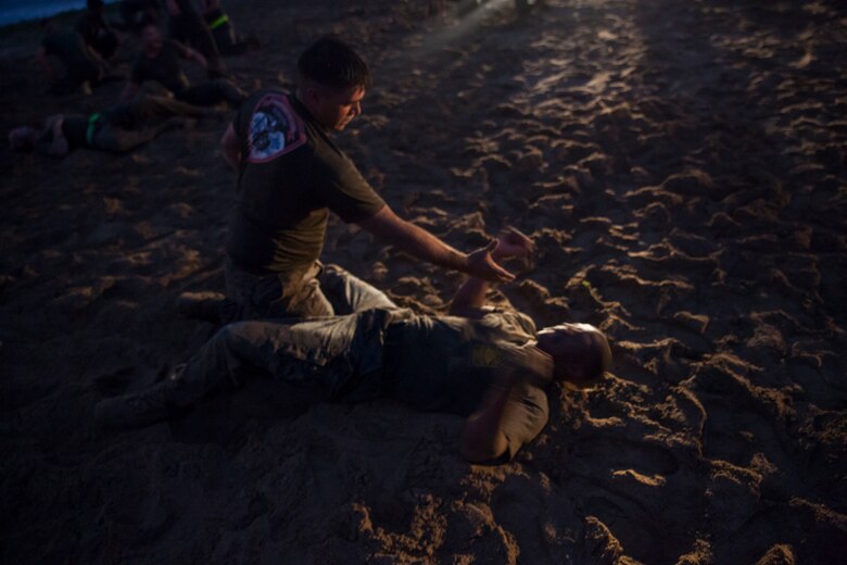 U.S. Marines with Combat Assault Company (CAC), 3rd Marine Regiment, prepare to step out on a motivational run commemorating the 74th anniversary of the Battle of Tarawa, Fort Hase Beach, Marine Corps Base Hawaii (MCBH), Nov. 20, 2017. CAC celebrated the anniversary with a motivational run and beach grappling to promote comradery among the Marines, while understanding the sacrifices at Tarawa. MCBH, along with its tenant units, strives to promote resiliency in remembering the past battles won and to instill in the newest generation what it means to be U.S. Marine.