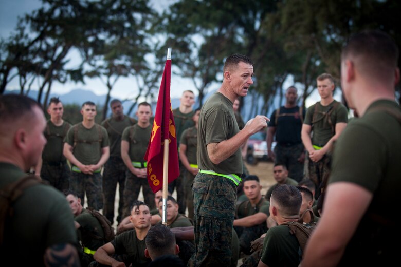 Col. Michael Styskal, the commanding officer of 3rd Marine Regiment, speaks to Marines with Combat Assault Company (CAC) on the 74th anniversary of the Battle of Tarawa, Fort Hase Beach, Marine Corps Base Hawaii (MCBH), Nov. 20, 2017. CAC celebrated the anniversary with a motivational run and beach grappling to promote comradery among the Marines, while understanding the sacrifices at Tarawa. MCBH, along with its tenant units, strives to promote resiliency in remembering the past battles won and to instill in the newest generation what it means to be U.S. Marine.