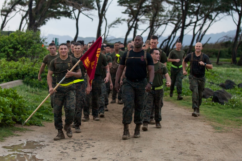 U.S. Marines with Combat Assault Company (CAC), 3rd Marine Regiment, prepare to step out on a motivational run commemorating the 74th anniversary of the Battle of Tarawa, Fort Hase Beach, Marine Corps Base Hawaii (MCBH), Nov. 20, 2017. CAC celebrated the anniversary with a motivational run and beach grappling to promote comradery among the Marines, while understanding the sacrifices at Tarawa. MCBH, along with its tenant units, strives to promote resiliency in remembering the past battles won and to instill in the newest generation what it means to be U.S. Marine.
