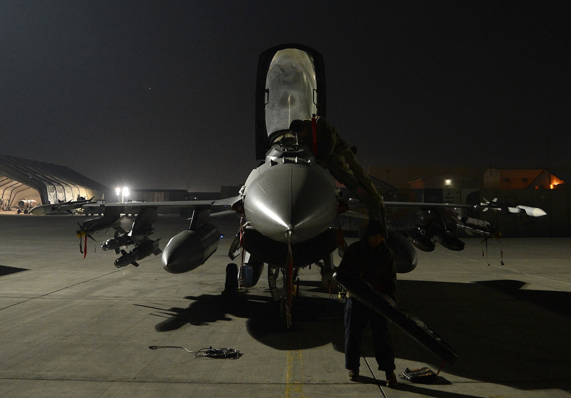 U.S. Airmen with the 455th Expeditionary Aircraft Maintenance Squadron prepare an F-16 fighting falcon assigned to the 77th Fighter Squadron for takeoff Nov. 21, 2017 at Bagram Airfield, Afghanistan.