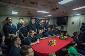 Sailors listen to the Commander-in-Chief, President Donald Trump, aboard the guided- missile cruiser USS Monterey (CG 61).