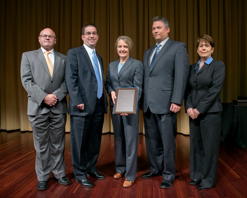 Recipients hold award