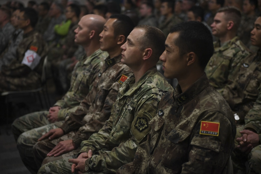 Participants listen to remarks during the opening ceremony of the 2017 U.S.-China Disaster Management Exchange at Camp Rilea, Ore.