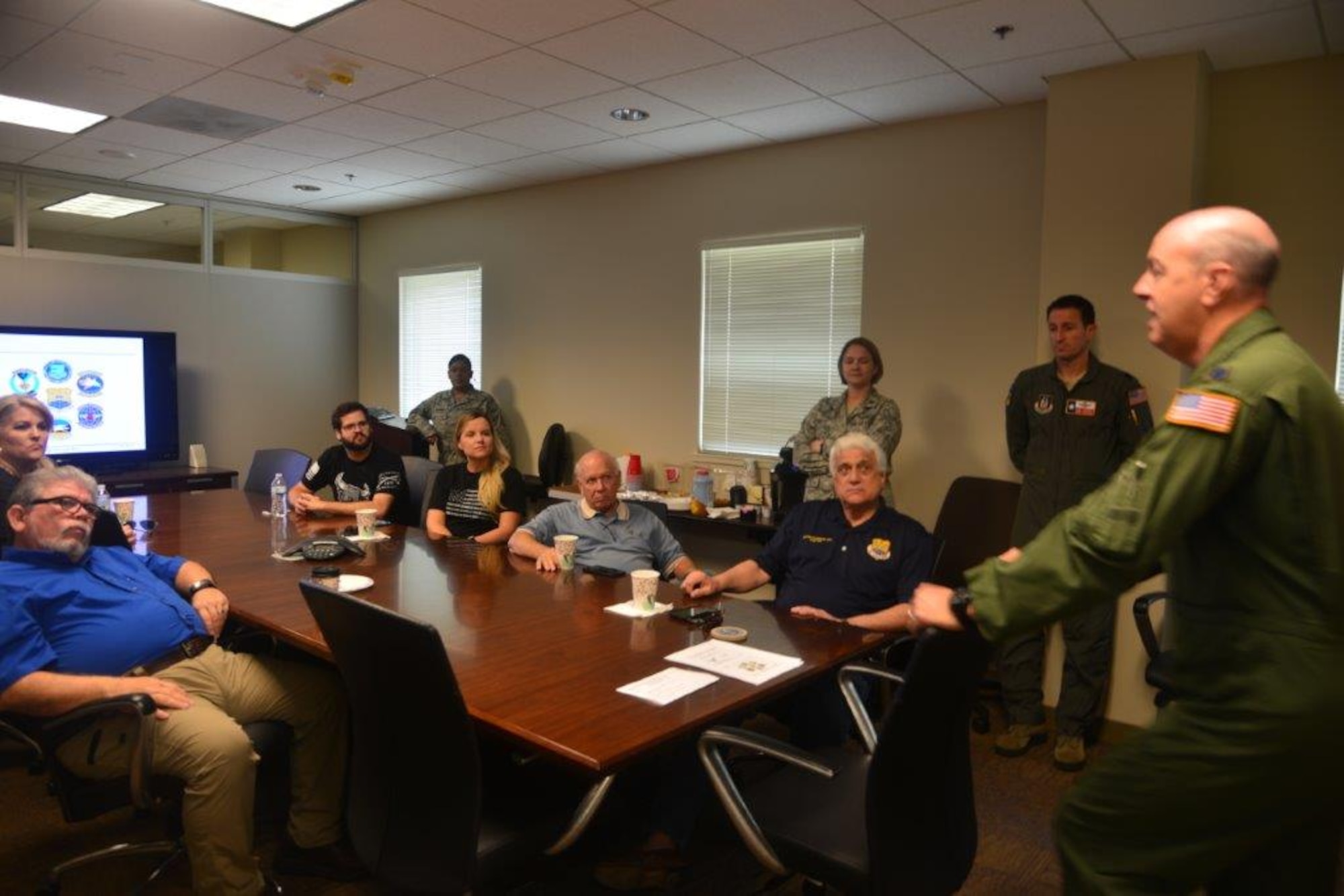 Lt. Col. James C. Miller, 433rd Operations Group Commander, JBSA-Lackland, Texas gives a mission brief to a group of Honorary Commanders and San Antonio’s civic leaders, Nov. 18, 2017, during an Operations’ Group tour before experiencing flight in a C-5M Super Galaxy Simulator. (U.S. Air Force photo by Minnie Jones)
