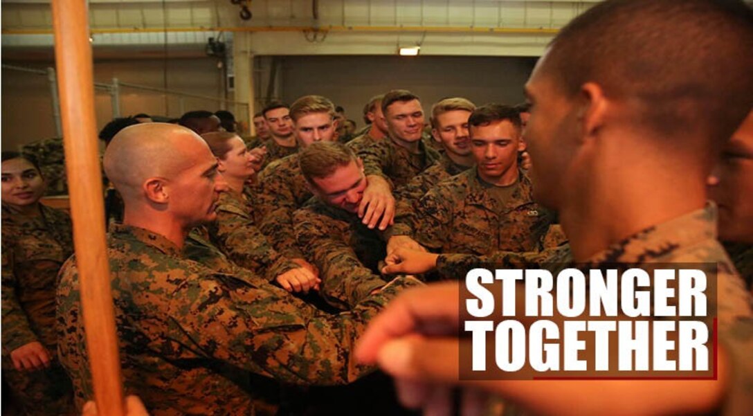 Marines and Sailors with Headquarters and Service Company, Combat Logistics Regiment 3, 3rd Marine Logistics Group, III Marine Expeditionary Force, huddle together during a motivational chant after a regimental formation Oct. 17, 2017 at Camp Mujuk, Pohang, Republic of Korea. The Marines participate in bilateral training with the Republic of Korea Marine Corps during Winter Workhorse 17/Korean Marine Exchange Program 18.1. The U.S. Marine Corps and the Republic of Korea Marine Corps have a resilient history dating back to 1953 with the signing of the Mutual Defense Treaty. (U.S. Marine Corps photo by Sgt. Tiffany Edwards)