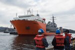 Yokosuka, Japan (November 27, 2017) The Arleigh Burke-class guided missile destroyer USS Fitzgerald (DDG 62) is towed back to the pier at Fleet Activities (FLEACT) Yokosuka, Nov. 27. Fitzgerald returned to repair two punctures in her hull caused by the heavy lift vessel Transshelf’s steel support structure during on load at anchorage. Repairs are expected to extend the on load process by a few days, after which Transshelf will transport Fitzgerald to Huntington Ingalls Industries (HII) in Pascagoula, Mississippi for further repairs and upgrades.