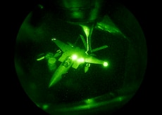 A Republic of Korea Air Force F-15 Eagle maneuvers toward a 909th Air Refueling Squadron KC-135 Stratotanker during a refueling exercise Sept. 12, 2016, over the Pacific Ocean. The 909th and ROKAF trained together to enhance nighttime, long-distance flying capability. (U.S. Air Force photo by Senior Airman Peter Reft)