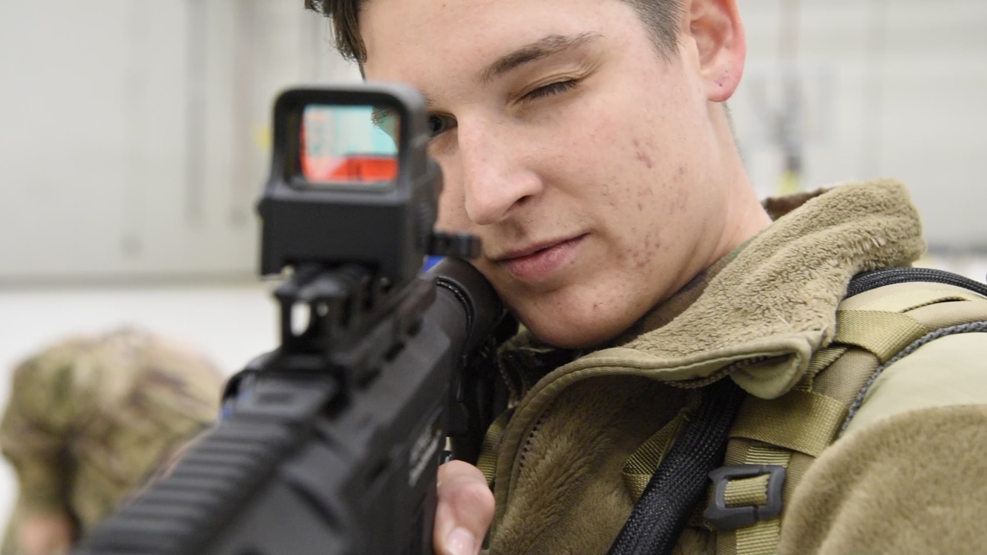 Senior Airman Maria Joyce, 455th Expeditionary Security Forces Squadron Echo sector command controller, looks down the site of a weapon during training Nov. 22, 2017 at Bagram Airfield, Afghanistan.