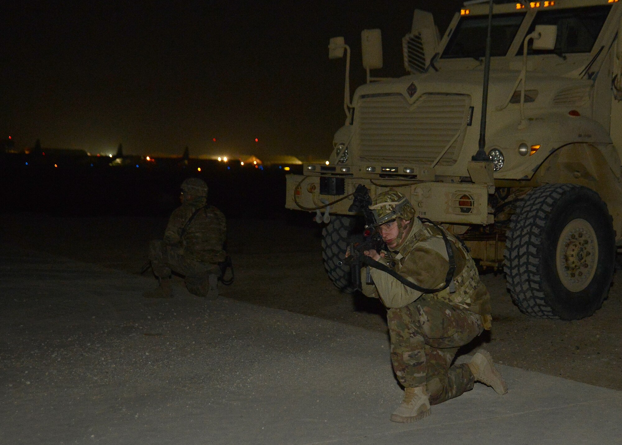 Senior Airman Maria Joyce (right), 455th Expeditionary Security Forces Squadron Echo sector command controller, and Airman 1st Class Henry Soto, 455th ESFS patrolman, provide flight line security Protected Nov. 23, 2017 at Bagram Airfield, Afghanistan.