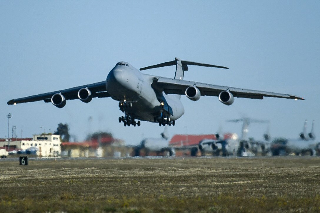 A military aircraft takes off.