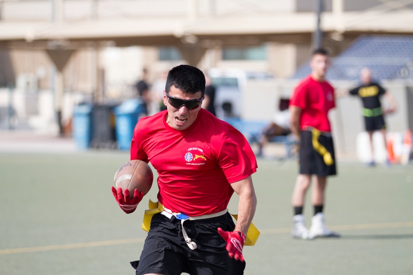 Man running with a football.