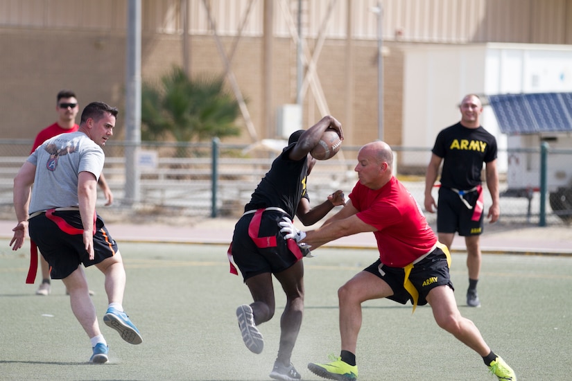 Men playing flag football.