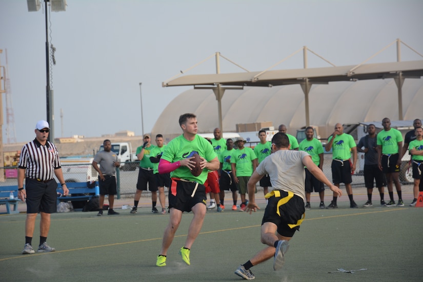 Soldiers play a game of flag football.