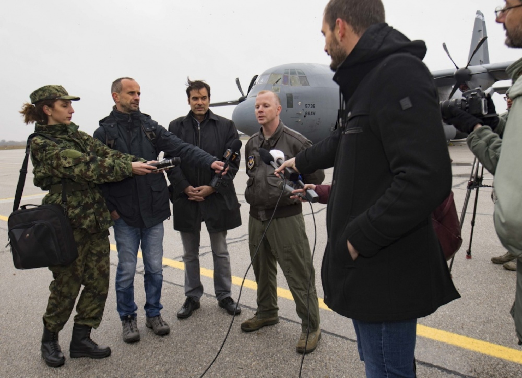 Serbian media representatives interview Maj. Jared Sorensen, 37th Airlift Squadron C-130J Super Hercules pilot, on Batajnica Airfield, Serbia, Nov. 14, 2017. Interviews and guided tours through a 37th AS C-130J kicked off Exercise Double Eagle, a bi-lateral airborne insertion exercise designed to improve emergency rapid-response and strengthen regional security. (U.S. Air Force photo by Senior Airman Elizabeth Baker)