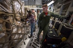 Air Force Staff Sgt. Adam D. Van Horn, C-17 Globemaster III loadmaster assigned to the 514th Air Mobility Wing's 732nd Airlift Squadron, locks a cargo pallet in place at Joint Base Charleston, S.C., Nov. 17, 2017. Air Force photo by Master Sgt. Mark C. Olsen