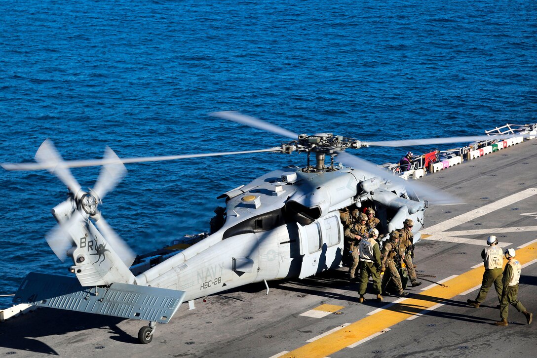 Marines return to the amphibious assault ship USS Iwo Jima after a simulated visit, board, search and seizure mission.