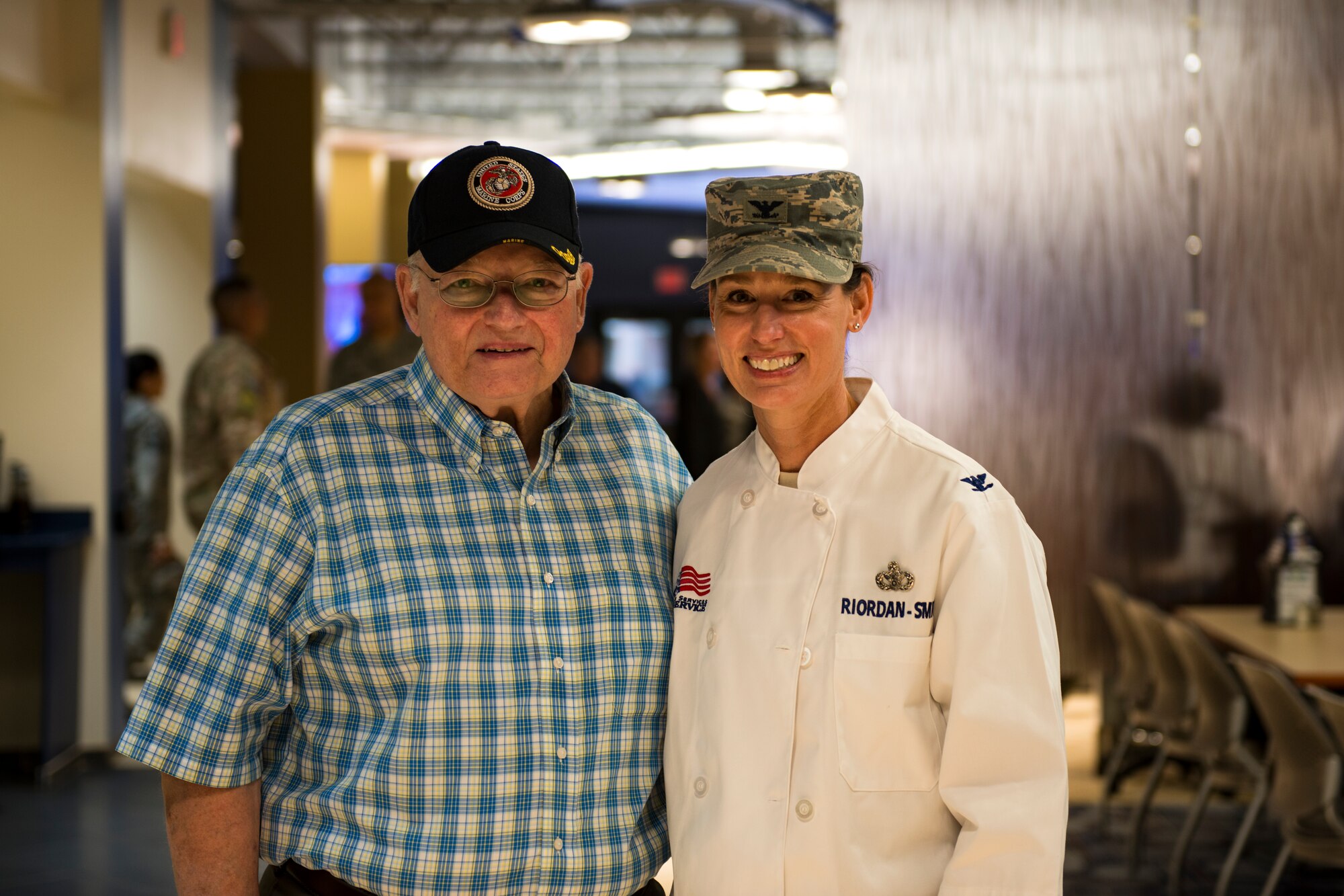 Retired U.S. Marine Lt. Col. Jim Riordan, left, and his daughter, Col. Susan Riordan-Smith, 23d Mission Support Group commander, pose for a photo on Thanksgiving Day in the Georgia Pines Dining Facility, Nov. 23, 2017, at Moody Air Force Base, Ga. The Thanksgiving Day meal was an opportunity for Airmen, retirees, dependents and leadership to enjoy a traditional Thanksgiving meal. (U.S. Air Force photo by Airman 1st Class Erick Requadt)