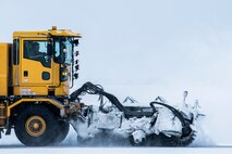 A snowplow clears the runway at Minot Air Force Base, N.D., Nov. 4, 2017, during exercise Global Thunder 18. Global Thunder is an annual command and control exercise designed to train U.S. Strategic Command forces and assess joint operational readiness. (U.S. Air Force photo by Senior Airman J.T. Armstrong)