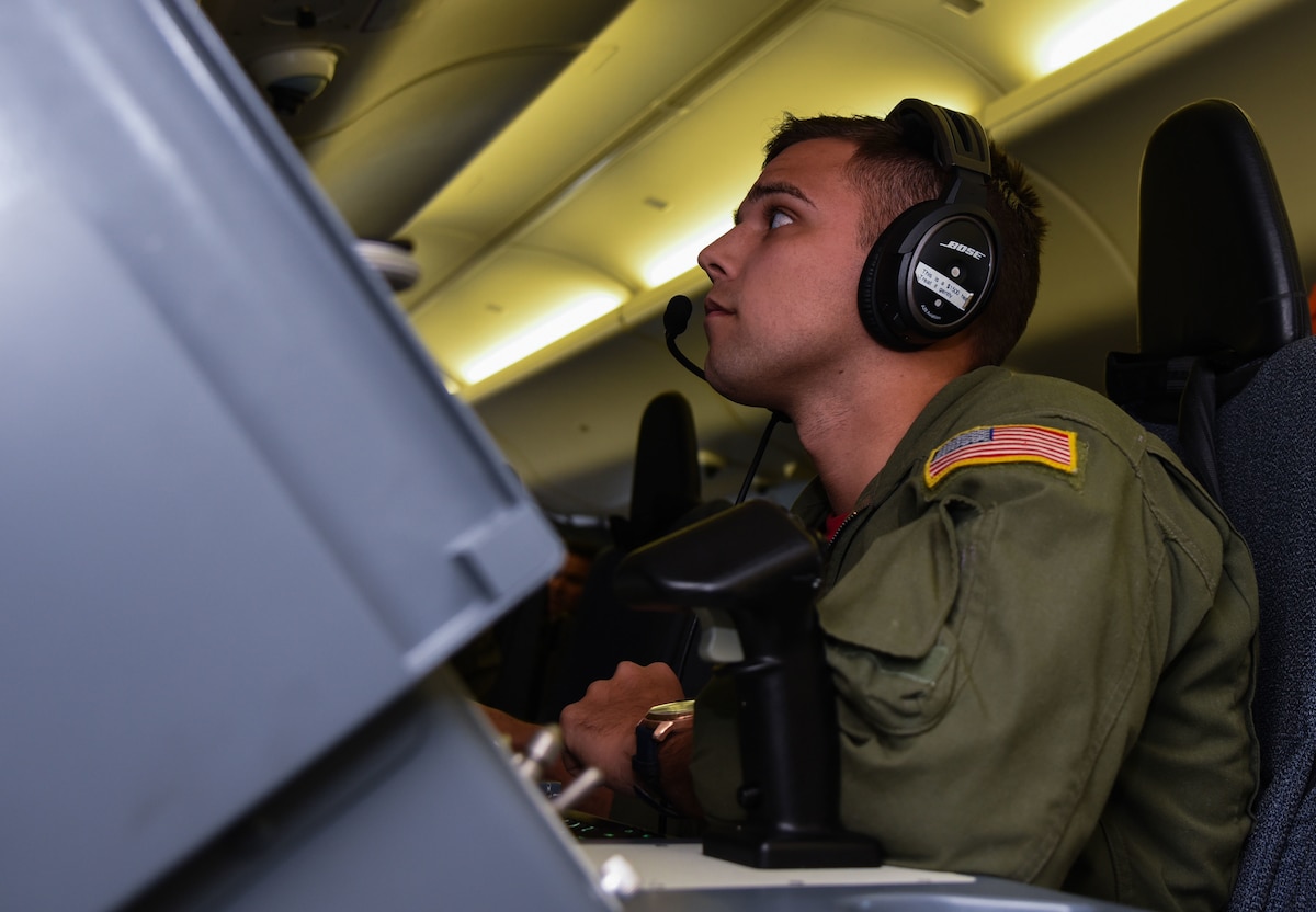 A Sailor operates a radar on a P-8a Poseidon aircraft.