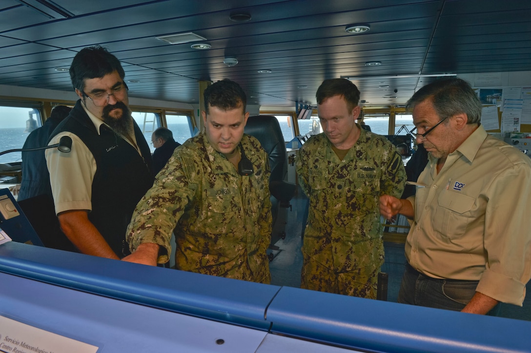 Sailors the bridge of the Norwegian construction support vessel Skandi Patagonia.