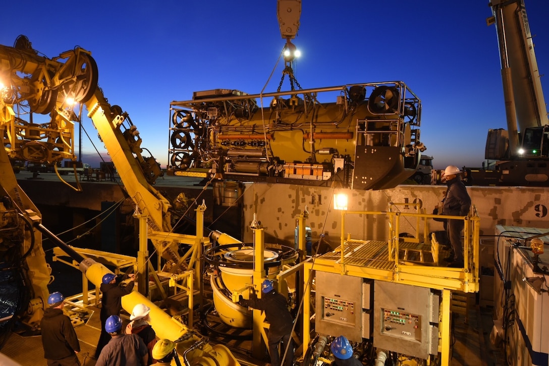 workers prepare the motor vessel Sophie Siem for the installation of the Pressurized Rescue Module.