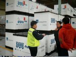 Yong Sik Pak (center) from DLA Disposition Services engages with customers at Camp Carroll on documentation and turn in procedures for the 1,400 line items of pre-positioned stock soon to be turned in at Gimcheon, South Korea.