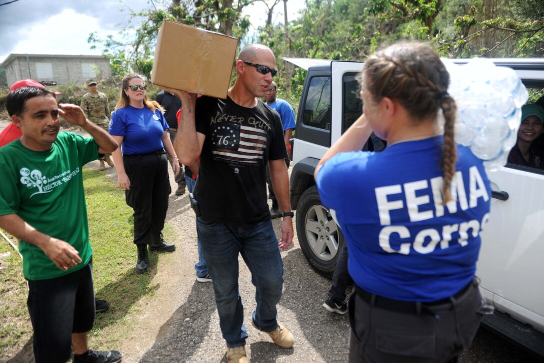 FEMA members deliver food and water.