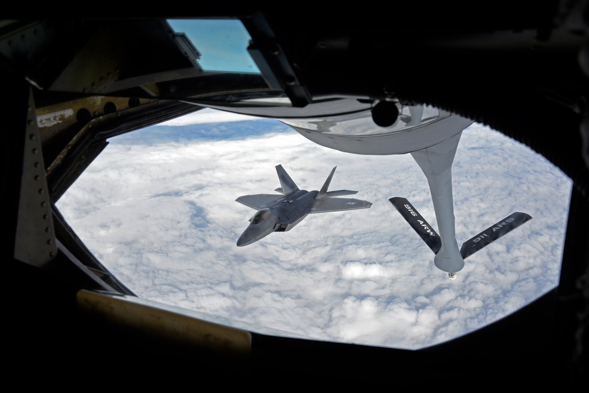 A KC-135 Stratotanker from Seymour Johnson Air Force Base, N.C. refuels an F-22A Raptor from the 95th Fighter Squadron, Tyndall Air Force Base, Florida, over European skies before landing at Mihail Kogalniceanu Air Base, Romania, April 25, 2016. The aircraft will conduct air training with other Europe-based aircraft to maximize training opportunities while demonstrating the U.S. commitment to NATO allies and the security of Europe. (U.S. Air Force photo by Capt. Leah Davis/Released)